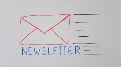 the word newsletter next to an envelope
