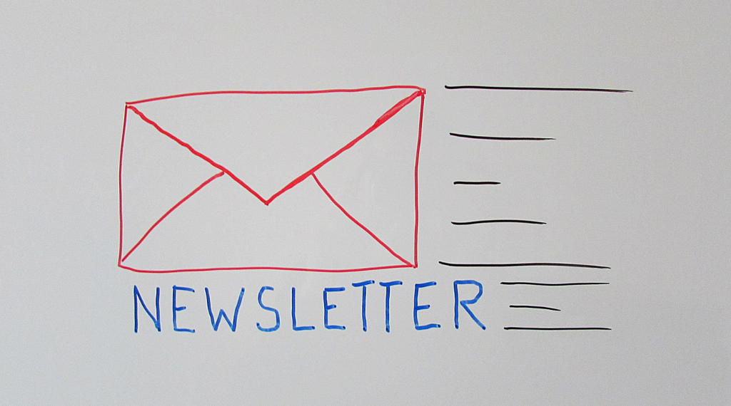 the word newsletter next to an envelope